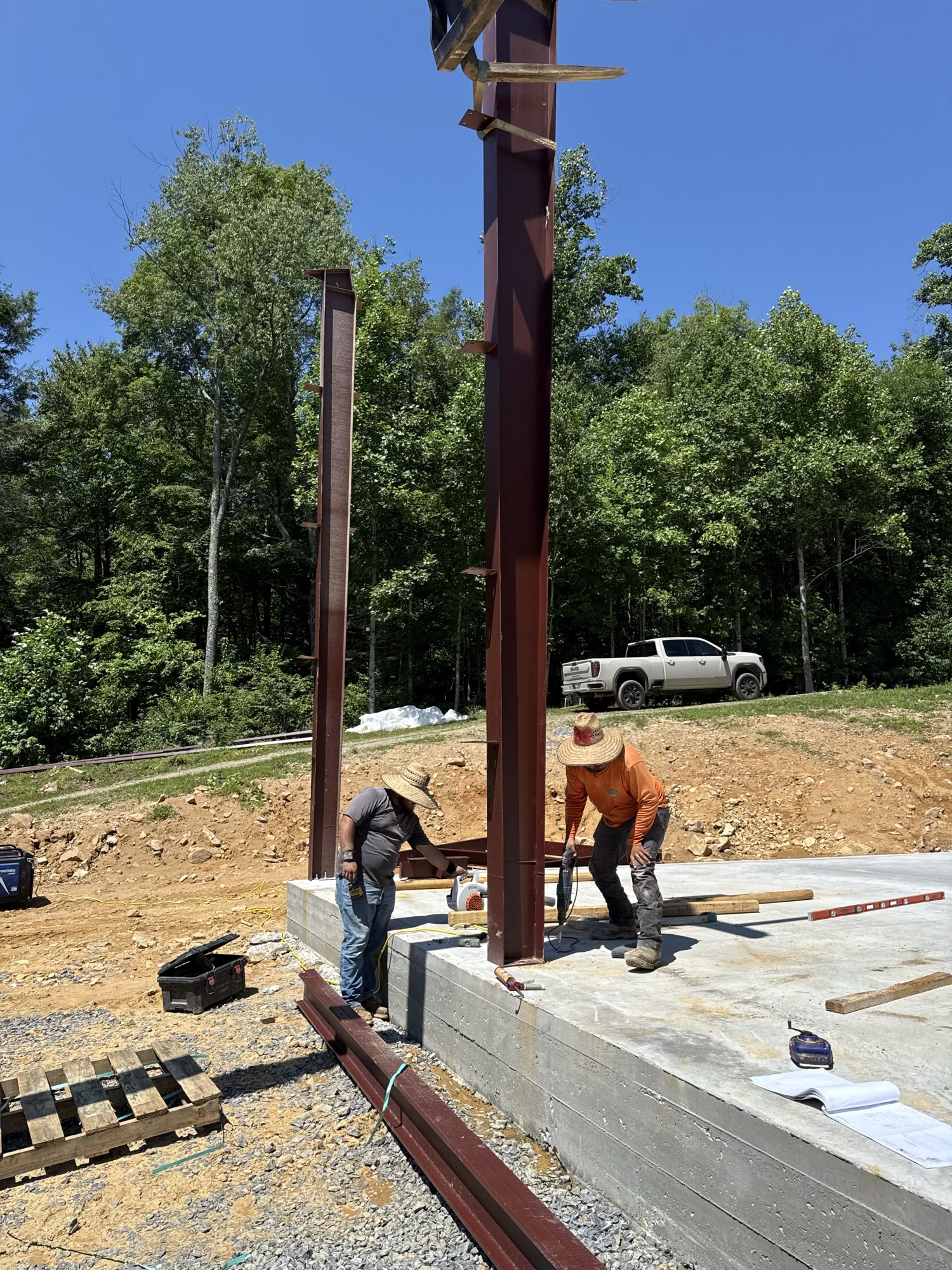 Column base plate being torqued down to the slab.