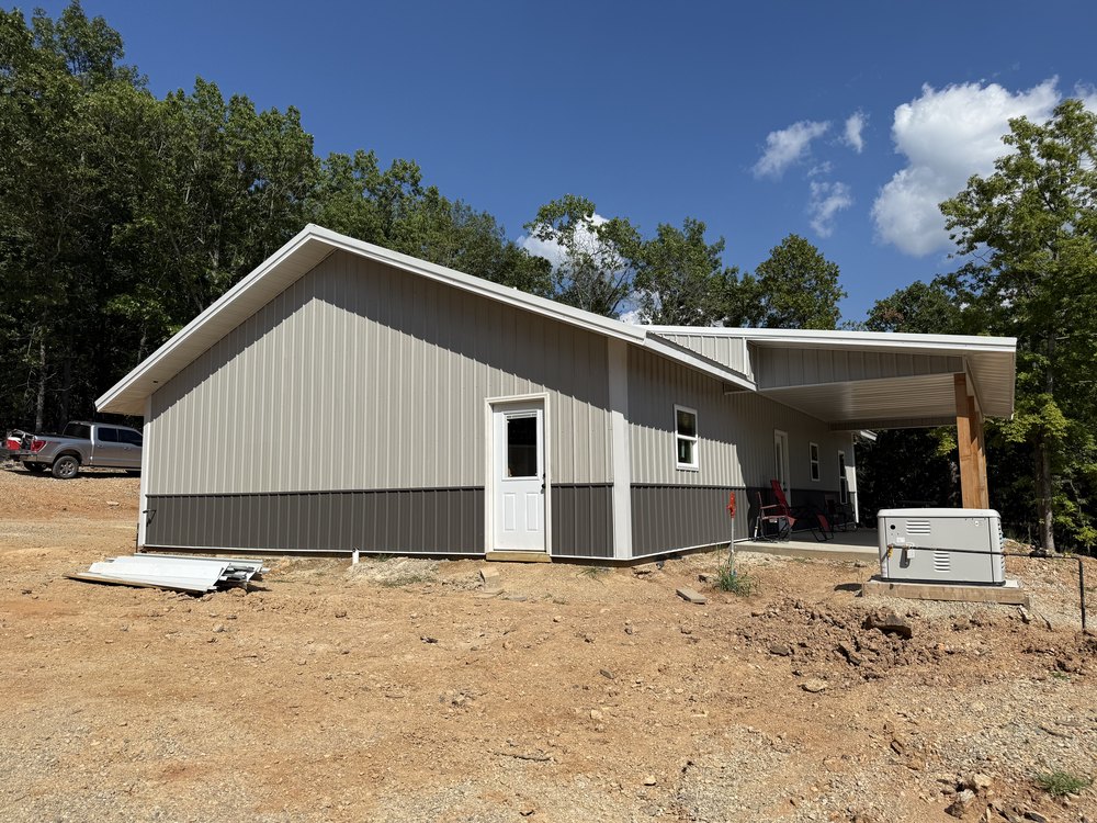 Rear elevation showing the service door and generator install.