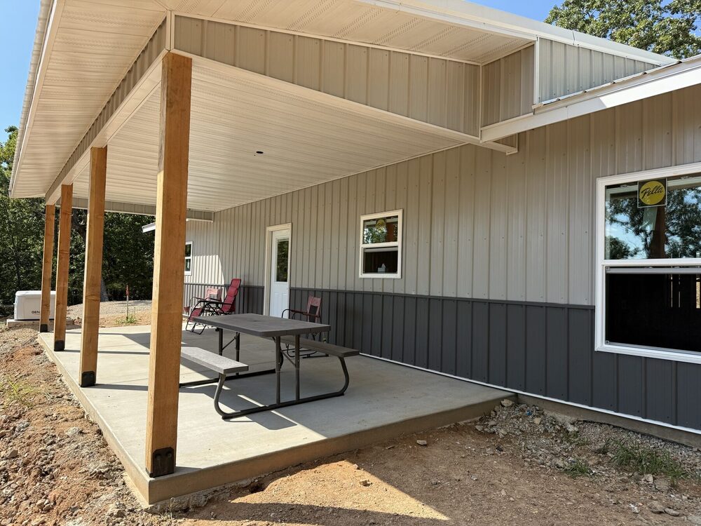 Covered rear patio on the steel-frame barndominium.