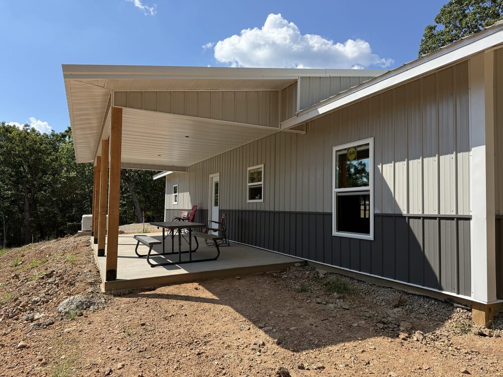 Rear patio column and beam detail on the steel-frame barndominium.